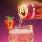 A can of Brightside sparkling drink tilted to pour into a clear glass, with a sliced strawberry garnish on the rim, against a purple gradient background with bright light effects.