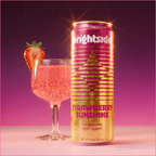 On the Brightside Strawberry Sunshine soda can with a glass of it with strawberry garnish on a purple background