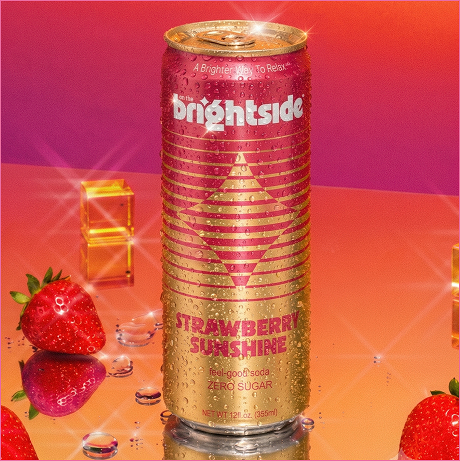 Can of Brightside Strawberry Sunshine drink on a reflective surface with strawberries and pink and purple background